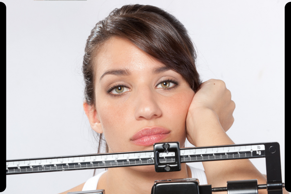 frustrated woman on scale