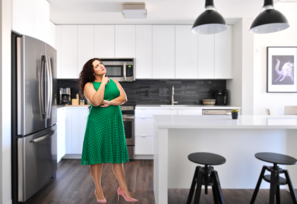 Woman thinking in kitchen 4x2.75
